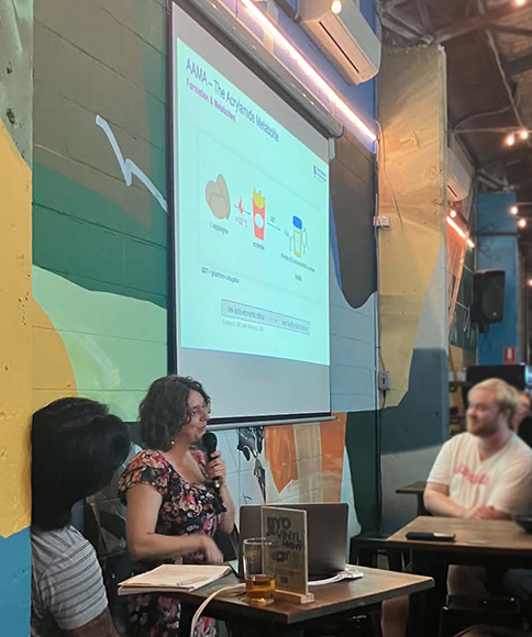 Nicole Schroeter presenting at Pint of Science