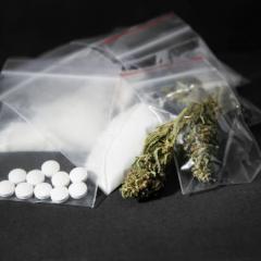 Various drugs such as pills and marijuana plastic bags. 